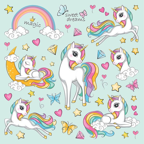 Wandsticker-Set mit Einhörnern, Regenbogen, Sternen und Herzen über einem Kinderschreibtisch.