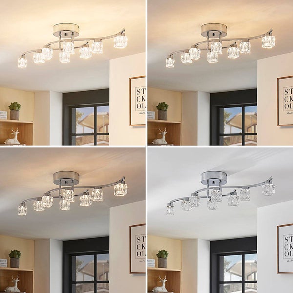 Moderne Deckenleuchte mit neun Glasschirmen und verchromtem Gestell in einem hellen Raum, zeigt verschiedene Lichtfarben von Warmweiß bis Kaltweiß.