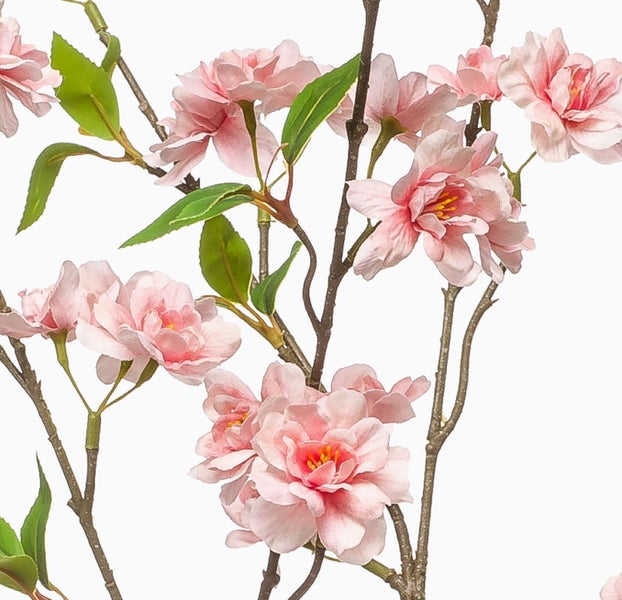 Künstlicher Zweig mit rosa Blüten und grünen Blättern.