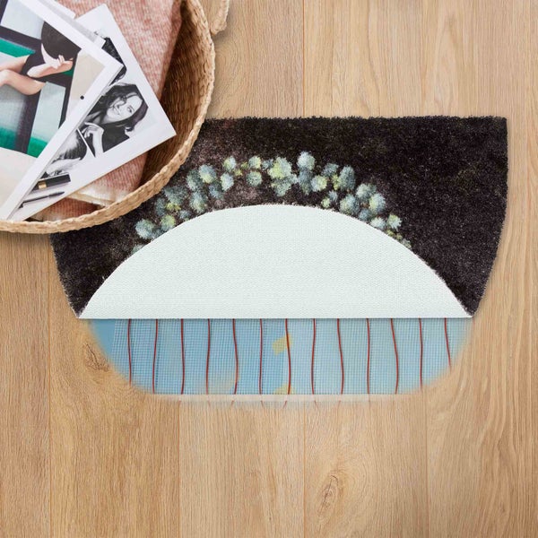 Schmutzfangmatte mit Pflanzenmotiv und Anti-Rutsch-Rückseite auf Holzboden