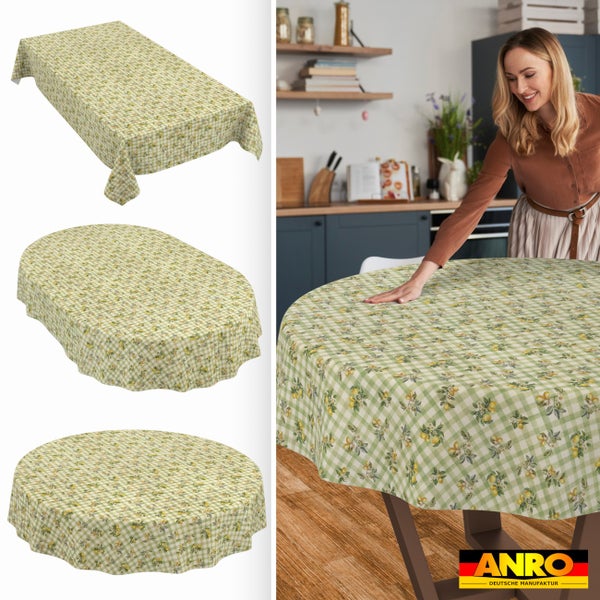 Wachstuch-Tischdecke mit Zitronen-Motiv und Karomuster in rechteckiger, ovaler und runder Form. Lifestyle-Bild in einer Küche. ANRO Logo.