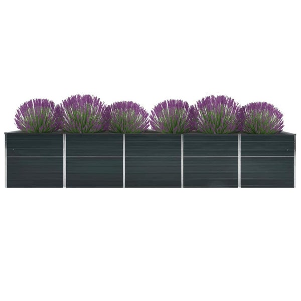 Rechteckiger Pflanzkasten aus anthrazitfarbenen Paneelen mit silbernen Metallstreben, bepflanzt mit Lavendel.