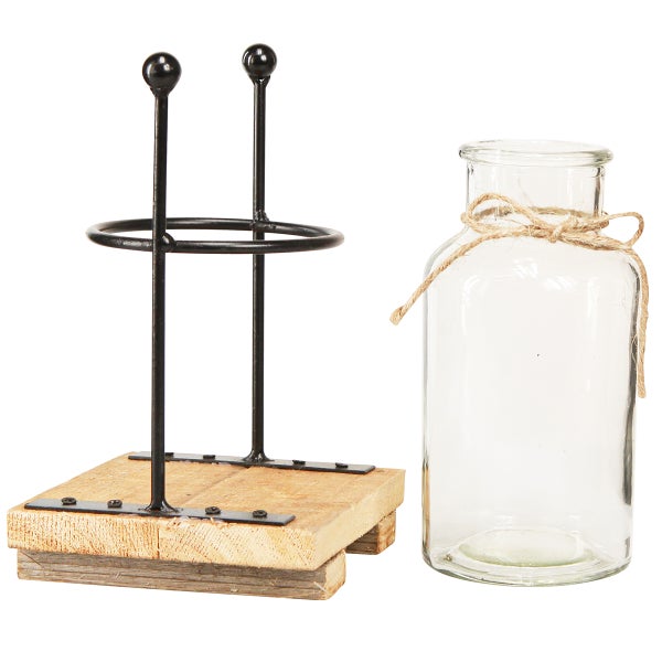 Dekorative Blumenvase mit Metallgestell auf Holzsockel