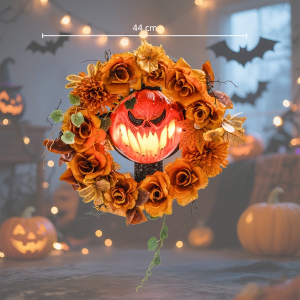 Halloween-Türkranz mit Kürbisgesicht-Dekoration und einem Durchmesser von 44 cm.