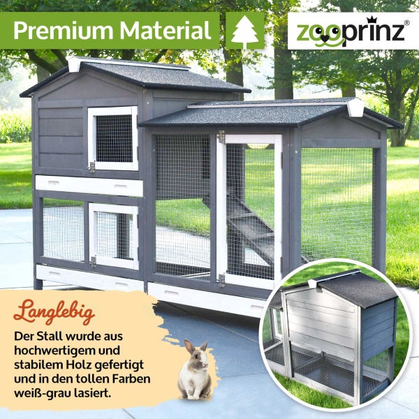 Grau-weißer zweistöckiger Kleintierstall aus Holz mit Rampe und Freilaufgehege. Symbol für hochwertiges Material. zooprinz Logo.