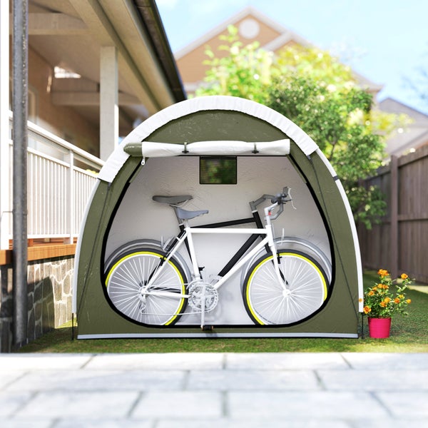 Bogenförmige Fahrradgarage aus Textil im Garten mit einem abgestellten Fahrrad.
