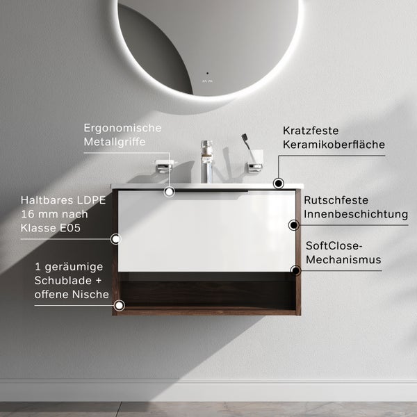 Moderner Waschtischunterschrank mit Schublade, offener Nische, kratzfester Keramikoberfläche und ergonomischen Griffen an einer hellen Wand.