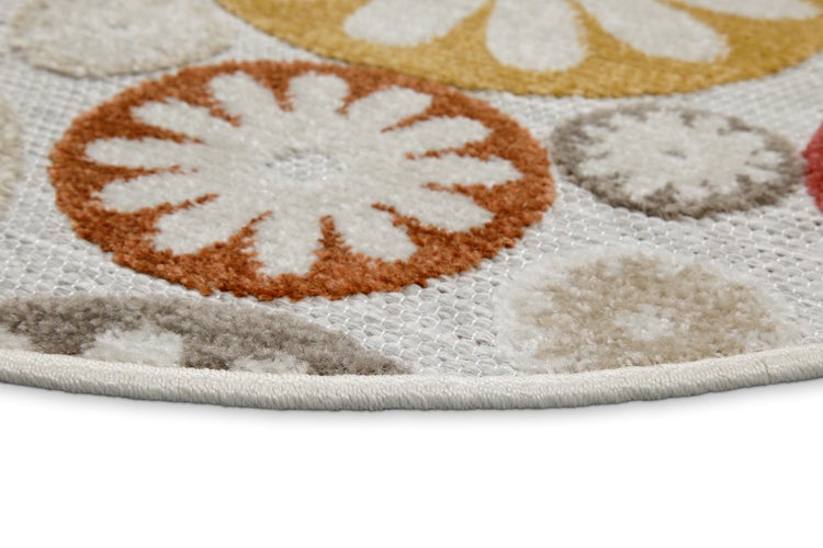 Runder Teppich mit Blumenmuster in Orange, Gelb und Grau, Detailansicht der Textur und des gekettelten Rands.
