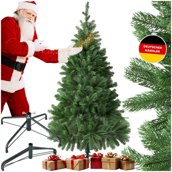 Künstlicher Weihnachtsbaum mit Ständer und Geschenkpaketen, daneben ein Weihnachtsmann und das Symbol Deutscher Händler