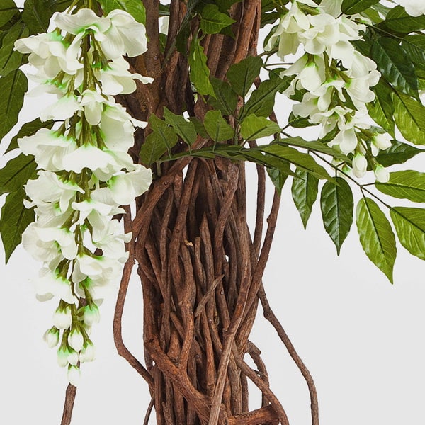 Künstliche Wisteria mit weißen Blüten, grünen Blättern und verschlungenem Stamm.