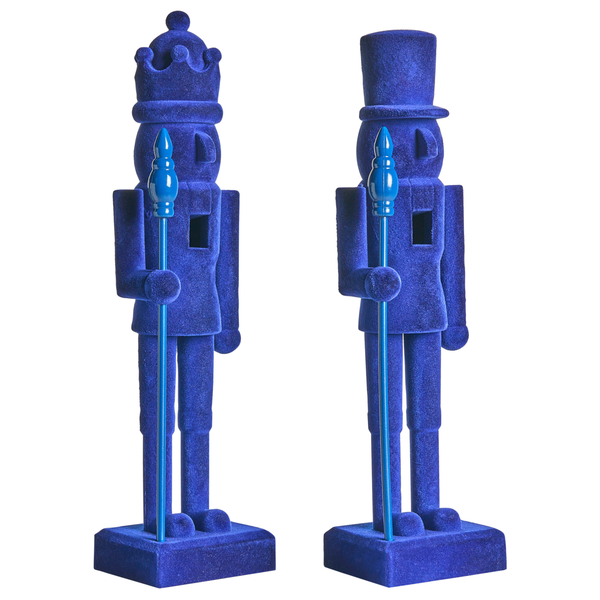 Zwei blaue Nussknackerfiguren, eine mit Krone und eine mit Zylinder