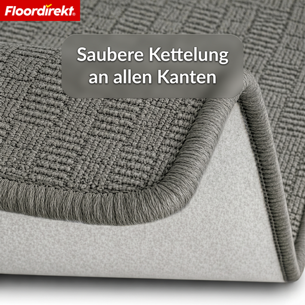 Floordirekt Logo. Teppich mit sauberer Kettelung an allen Kanten und strukturierter Oberfläche.