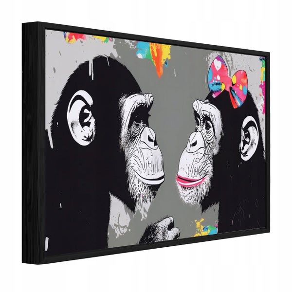 Wandbild mit Motiv von zwei Schimpansen im Pop Art Stil mit buntem Farbspritzer Akzenten in einem schwarzen Rahmen.
