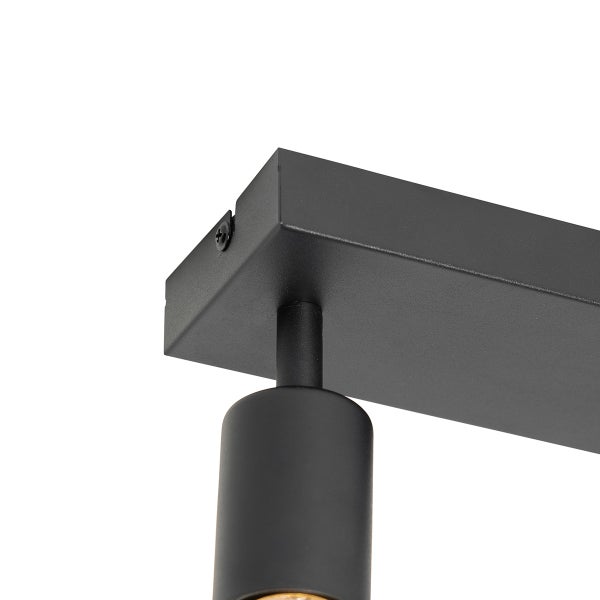 Detailaufnahme einer schwarzen Deckenleuchte mit Spot