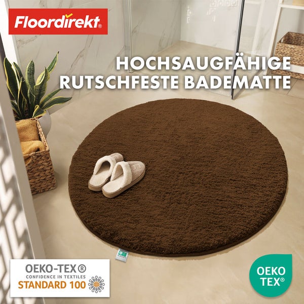 Runde, rutschfeste Badematte vor einer Dusche mit Hausschuhen und OEKO-TEX Siegel