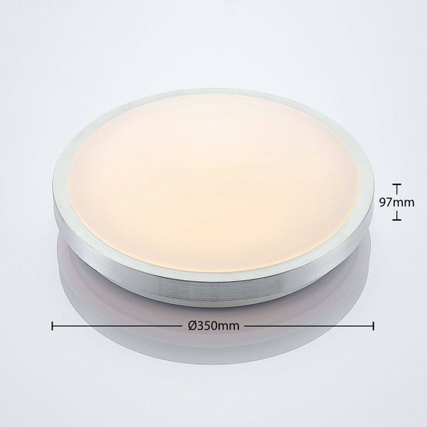 Weißer, zylindrischer Schienenstrahler für Stromschienensysteme, verstellbar.