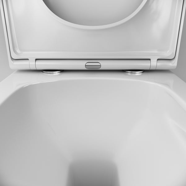 Toilettensitz mit Scharnieren und Entriegelungstaste zur Reinigung auf einer Toilettenschüssel.