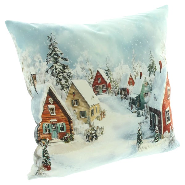Quadratisches Dekokissen mit weihnachtlichem Winterdorf Motiv und verschneiten Häusern für eine festliche Weihnachtsdekoration.