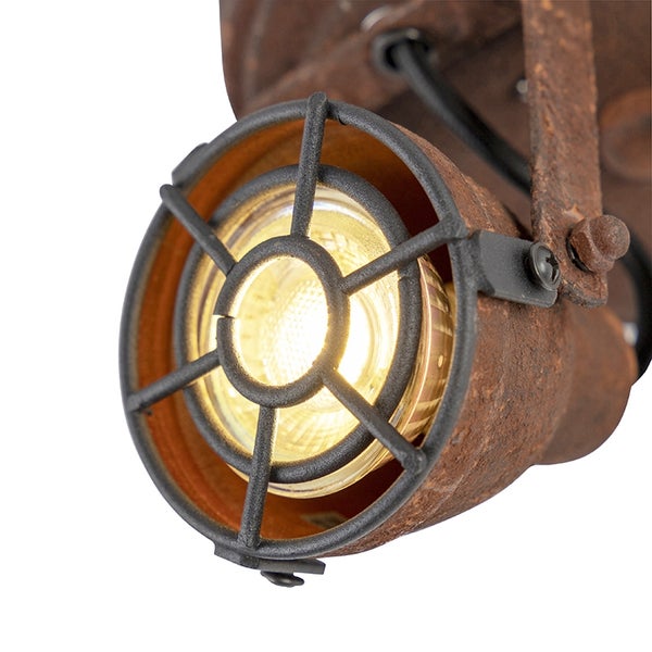 Rostfarbene Wandleuchte im Industriedesign mit Schutzgitter