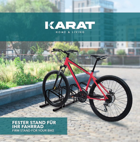 Fahrradständer aus Metall mit rotem Fahrrad