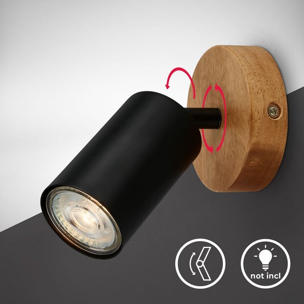 Wandstrahler mit schwarzem Zylinder und rundem Holzsockel, verstellbar und drehbar, Leuchtmittel nicht enthalten.