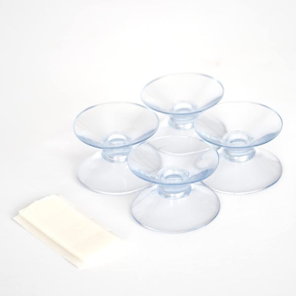 Vier Saugnäpfe mit Klebestreifen für die Befestigung