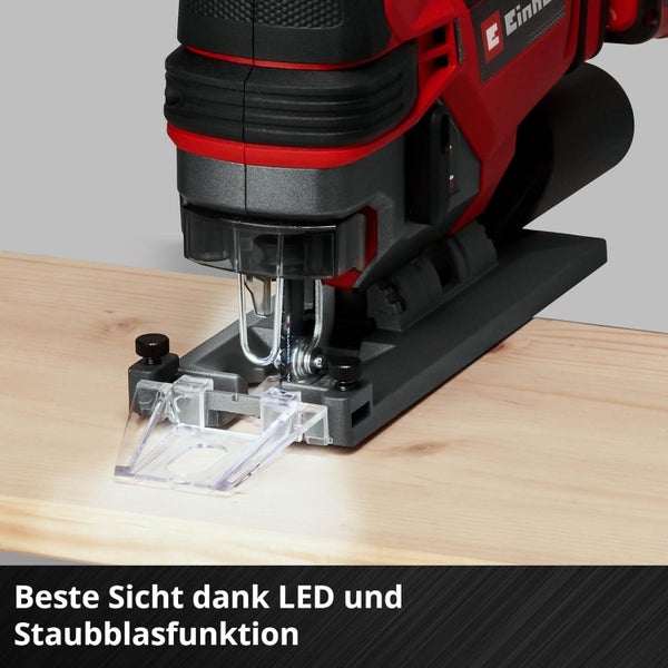 Einhell Pendelhubstichsäge auf einem Holzbrett mit LED Licht und Staubblasfunktion zur besseren Sicht auf den Schnittbereich.