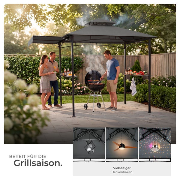 Dunkelgrauer Grillpavillon mit Doppeldach, Seitenablagen und integriertem Deckenhaken in einer sonnigen Gartenszene mit Personen am Grill.