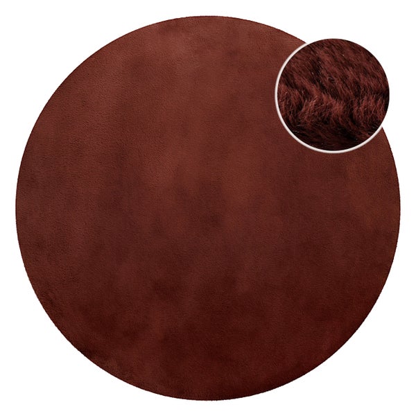 Runder Kunstfellteppich mit einer Detailansicht der weichen, langen Fasern.