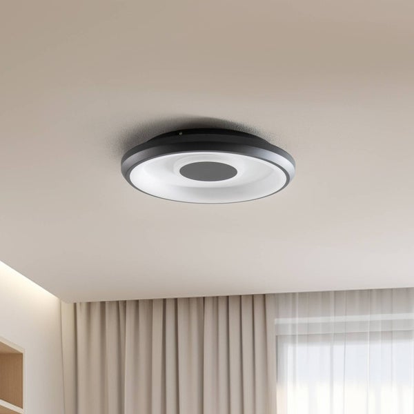 Moderne, runde LED-Deckenleuchte in Ringform mit schwarzem Gehäuse an einer hellen Zimmerdecke.