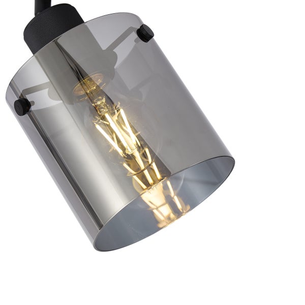 Moderne Innenleuchte mit rauchfarbenem Glasschirm und sichtbarer Glühbirne.