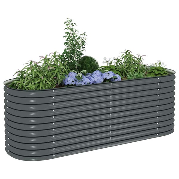 Ovales Hochbeet aus Wellblech, bepflanzt mit verschiedenen Grünpflanzen und Blumen.