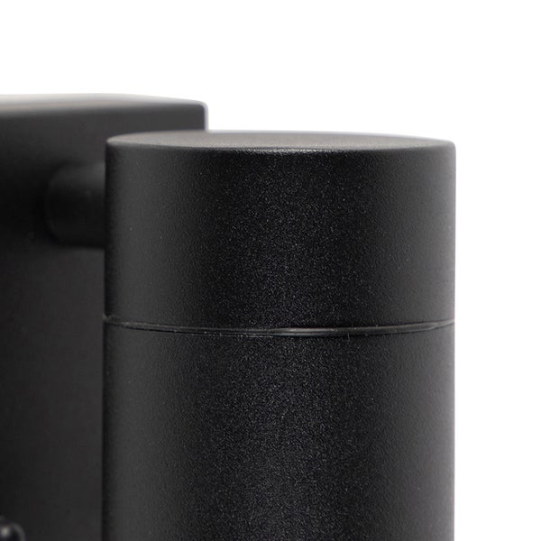 Detailansicht einer zylindrischen schwarzen Außenwandleuchte mit strukturierter, matter Oberfläche.