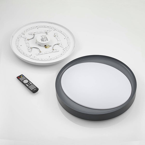 Rundes LED-Panel mit Fernbedienung und Montagesockel inklusive sichtbarer LED-Platine und Treiber.