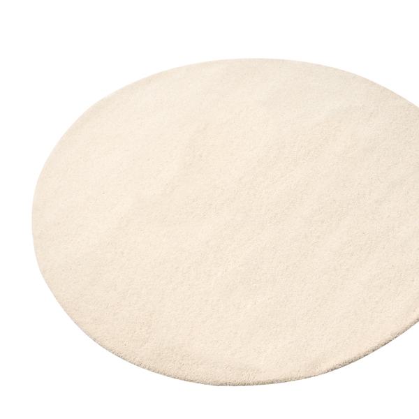 Runder Teppich mit weicher Textur in Hellbeige.