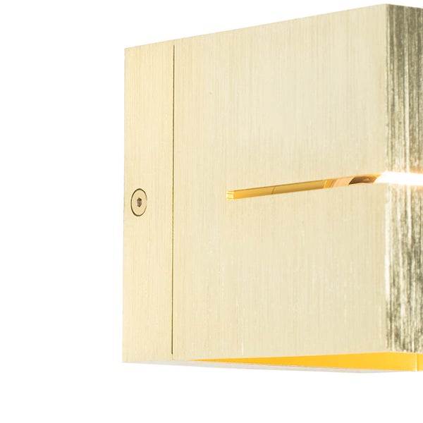 Goldene Wandleuchte mit Lichteffekt