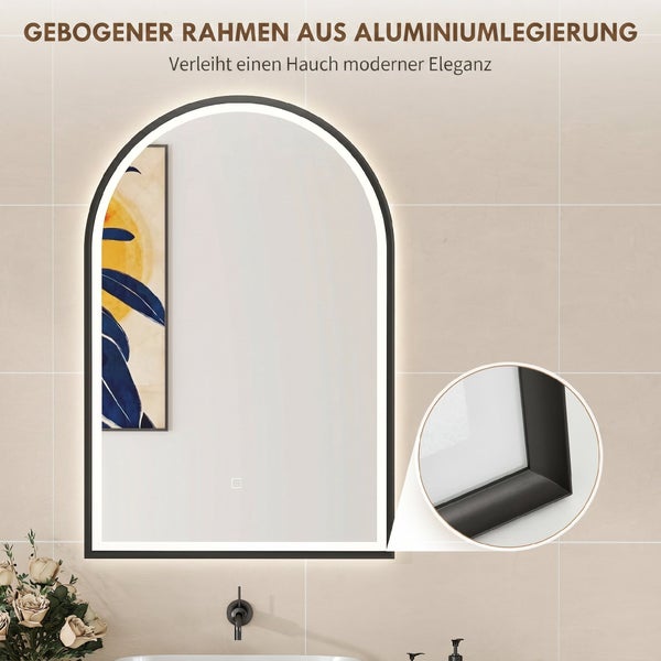 Bogenförmiger Badezimmerspiegel mit LED Beleuchtung und Aluminiumrahmen vor einer Fliesenwand