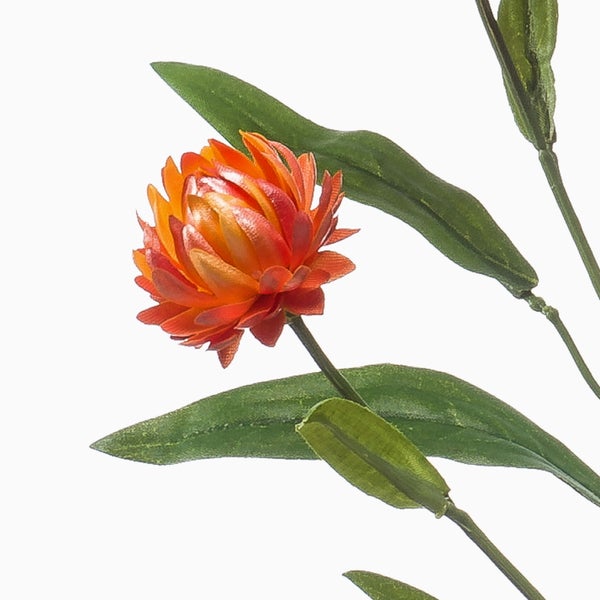 Künstliche Monstera Deliciosa Variegata mit weiß panaschierten Blättern im schwarzen Topf.