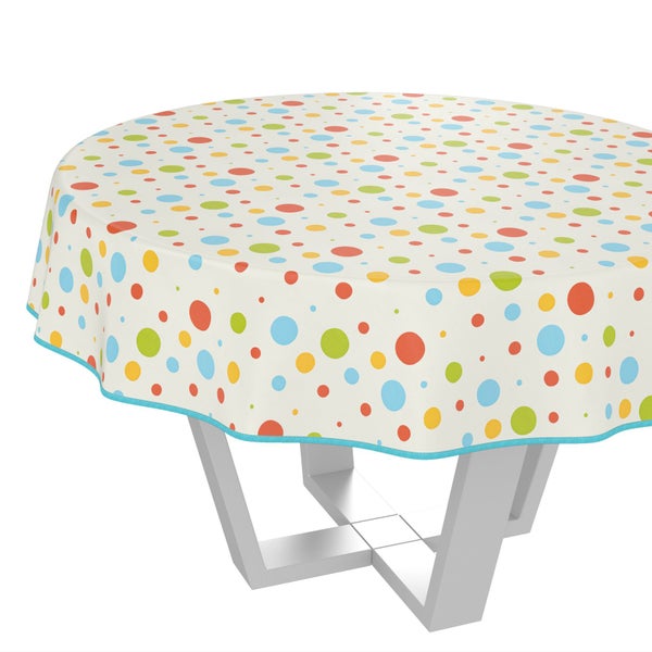 Runde Tischdecke mit Punktmuster auf einem Tisch