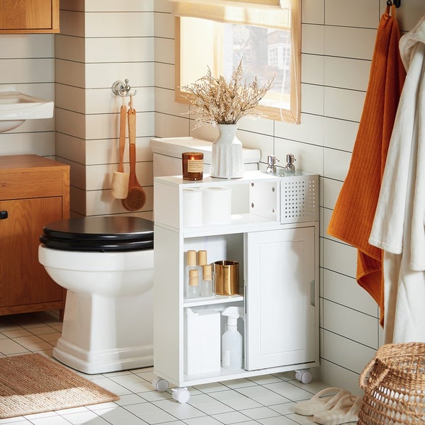 Badezimmer mit Toilette, Waschbecken und weißem Rollcontainer zur Aufbewahrung