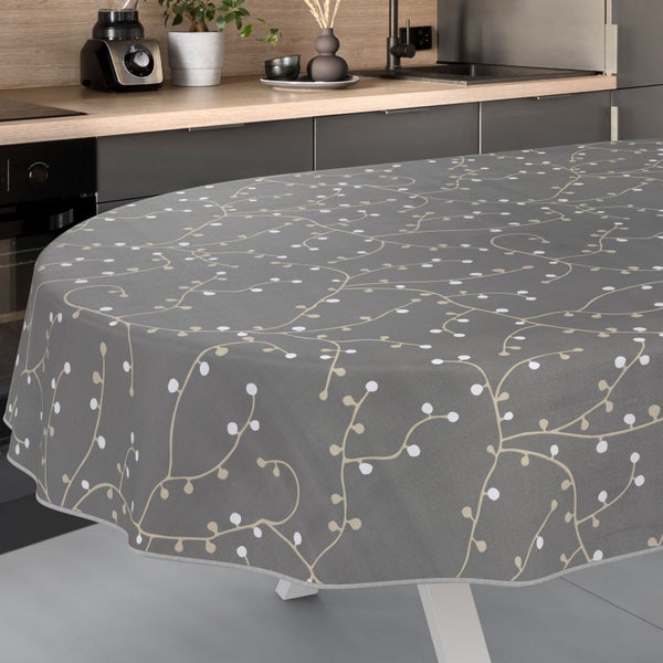 Graue Tischdecke mit Pflanzenmuster auf einem Küchentisch