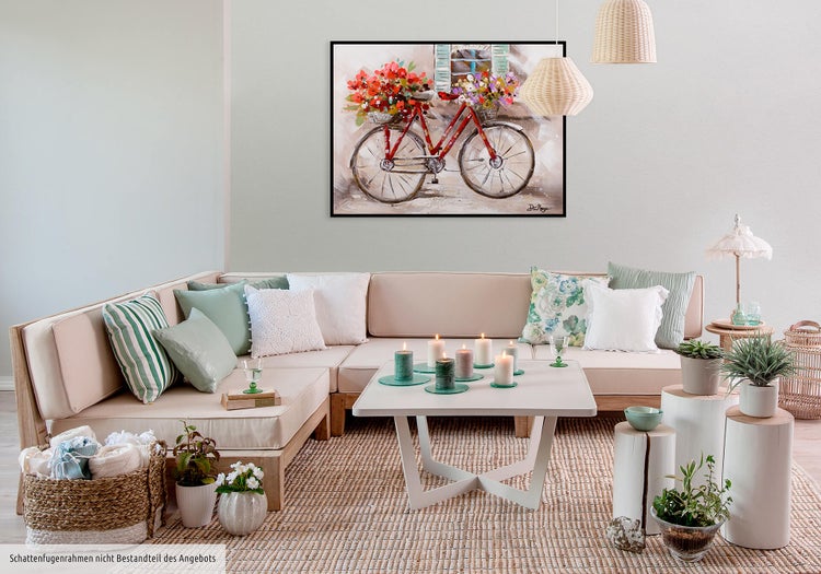 Gemälde eines Fahrrads mit Blumenkörben auf einer Staffelei