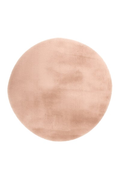 Runder Teppich in Felloptik, rosa, aus weicher Kunstfaser.
