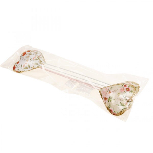 Herzförmige Pflanzenstecker mit Blumenmuster in transparenter Verpackung