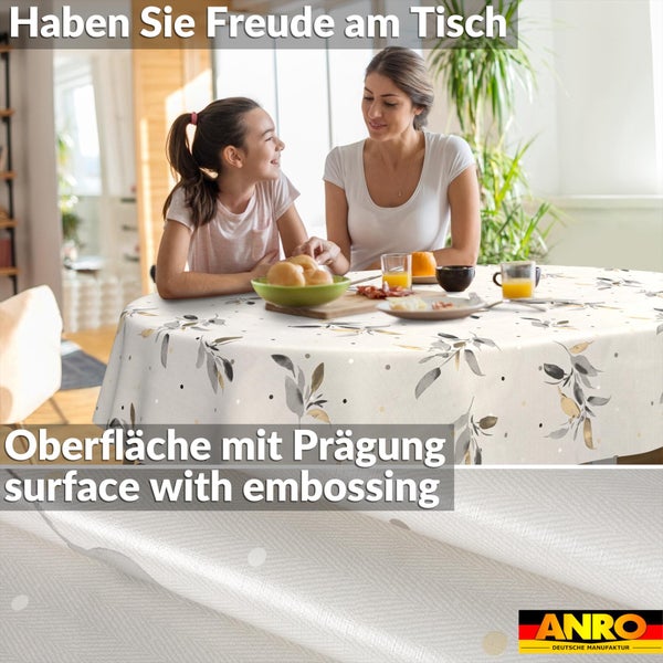 Runde Tischdecke mit Blattmuster und geprägter Oberfläche, Szene mit zwei Personen beim Frühstück, ANRO Logo.