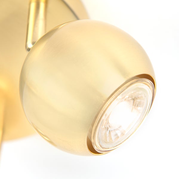 Goldfarbene Wandleuchte mit einzelnem Spot