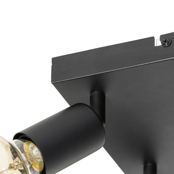 Detailansicht einer schwarzen Deckenleuchte mit Leuchtmittel