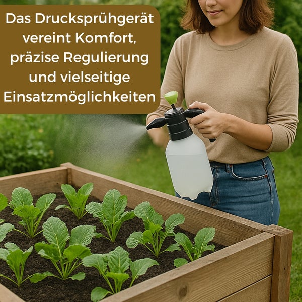 Eine Frau benutzt eine Drucksprühflasche, um Pflanzen in einem Hochbeet zu bewässern.