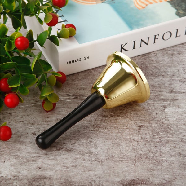 Glocke mit Griff auf einem Tisch
