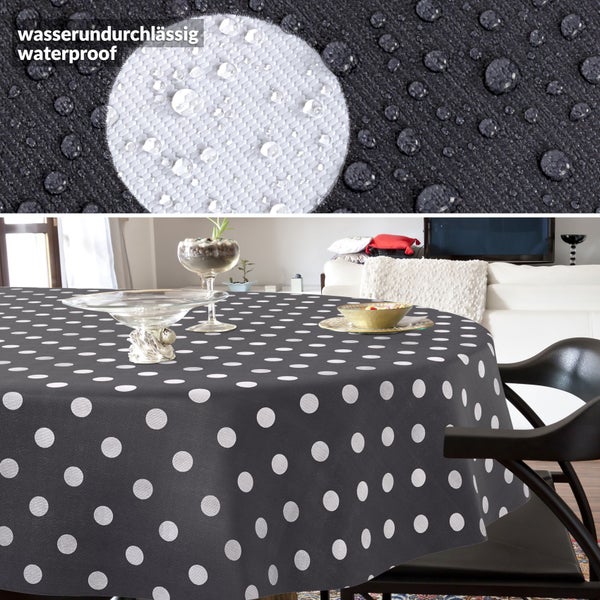 Wasserundurchlässige Tischdecke mit weißen Punkten, Detailaufnahme der wasserabweisenden Materialoberfläche.